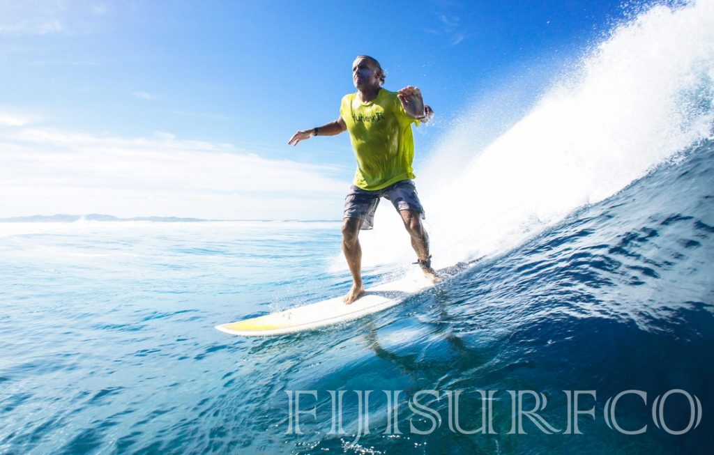 Surfer riding the waves - Courtesy of Fijisurfco Surfer riding the waves - Courtesy of Fijisurfco