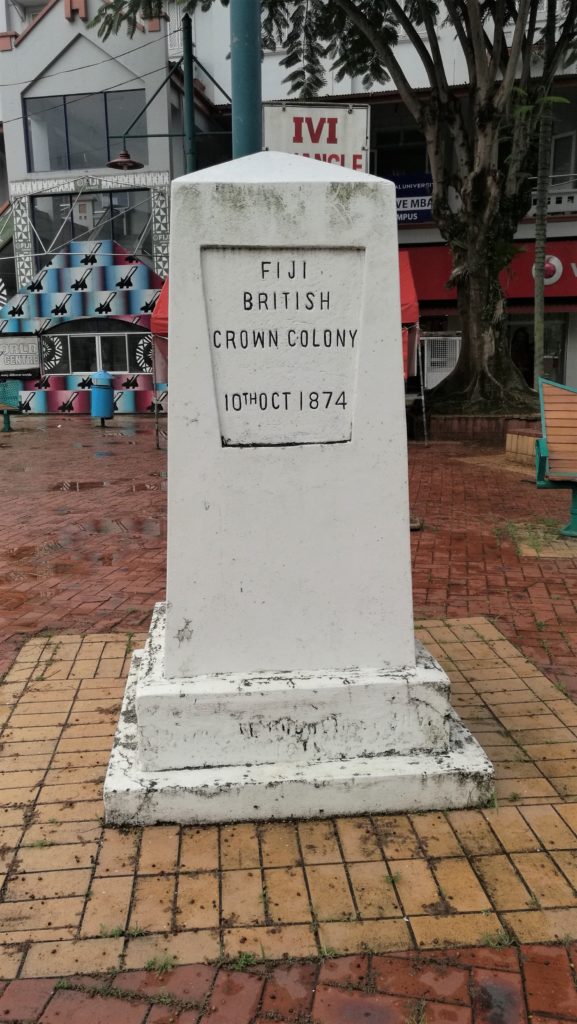 Fiji British Crown Colony Monument The triangle is what is usually called a “historic marker,” and it is an unusual one, for three of the four desscriptions are wrong, even if only slightly so. This descripition happens to be correct.