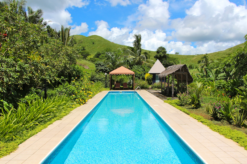 Palmlea Resort Pool is surrounded by a luxurious garden. Palmlea Resort Pool is surrounded by a luxurious garden.